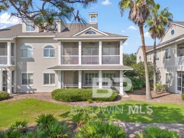 200 Peninsula Blvd Unit E101, Gulf Shores, AL 36542 - back of property featuring a sunroom and a yard