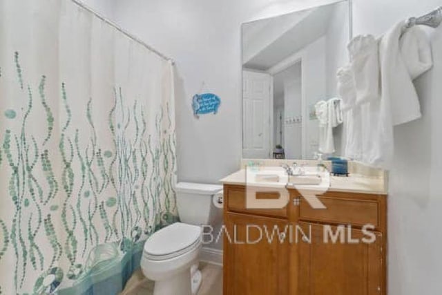 200 Peninsula Blvd Unit E101, Gulf Shores, AL 36542 - bathroom featuring vanity, toilet, and a shower with shower curtain