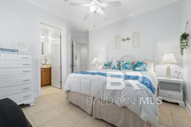 200 Peninsula Blvd Unit E101, Gulf Shores, AL 36542 - bedroom with light tile patterned flooring, connected bathroom, and a ceiling fan