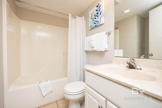 full bathroom featuring shower / tub combo with curtain, tile patterned floors, toilet, a textured ceiling, and vanity