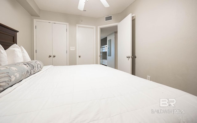 bedroom with ceiling fan and a closet