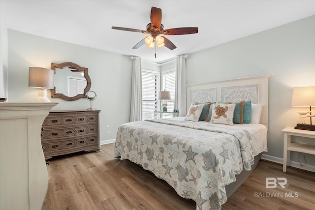 bedroom featuring ceiling fan and light hardwood / wood-style flooring