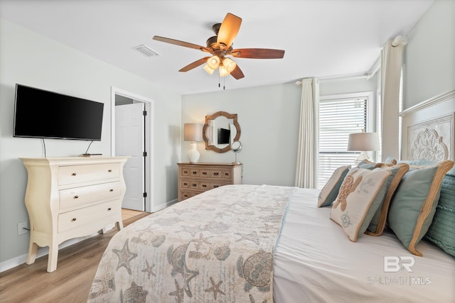 bedroom with ceiling fan and light hardwood / wood-style flooring
