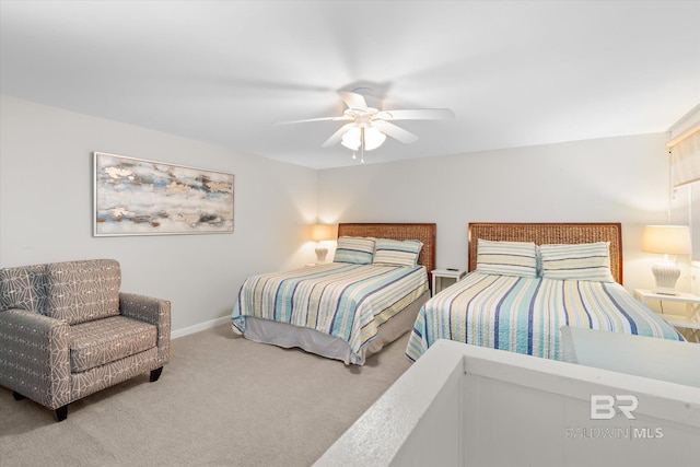 bedroom featuring ceiling fan and carpet