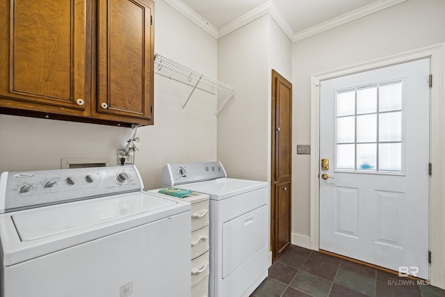 laundry area featuring cabinets, washer and dryer, and ornamental molding