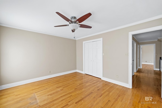 unfurnished bedroom with hardwood / wood-style floors, ceiling fan, a closet, and ornamental molding