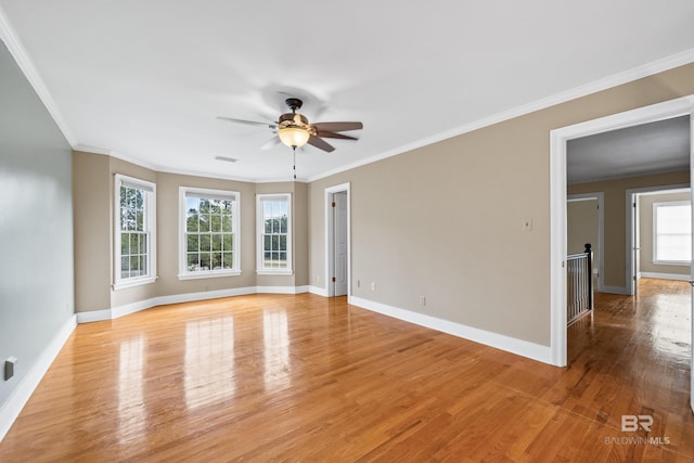 unfurnished room with light wood-type flooring, ceiling fan, and crown molding