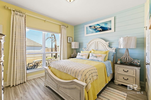 bedroom with light hardwood / wood-style floors