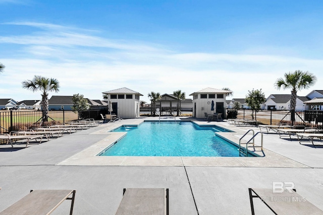 view of swimming pool featuring a patio area