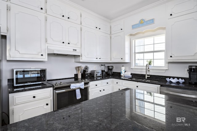 kitchen with appliances with stainless steel finishes, a sink, white cabinets, and under cabinet range hood