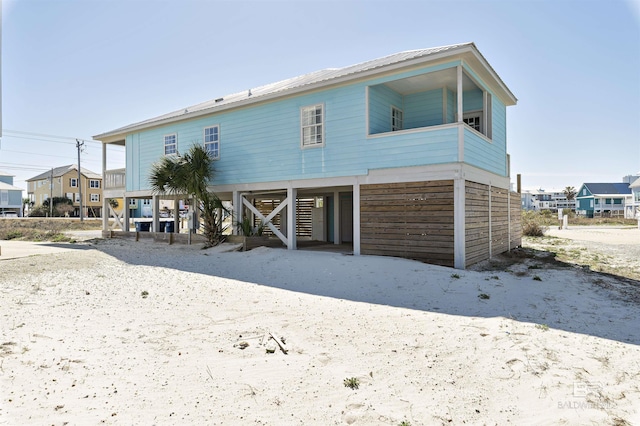 view of front of home featuring a carport and stairs