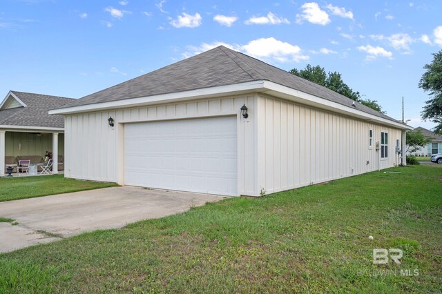 24154 Veranda Cir, Elberta, AL 36530 - view of property exterior featuring board and batten siding, a lawn, and driveway