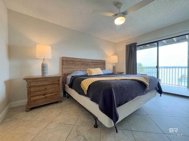 bedroom featuring access to exterior, baseboards, light tile patterned floors, a textured ceiling, and a ceiling fan