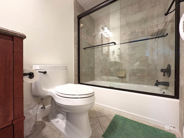 full bath featuring tile patterned flooring, toilet, and shower / bath combination with glass door