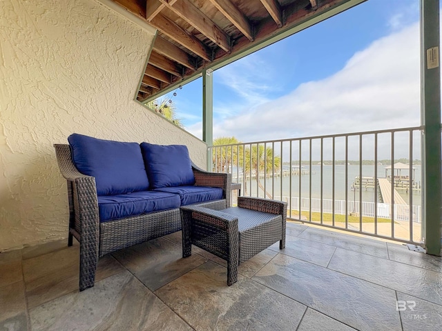 view of patio with a balcony and outdoor lounge area