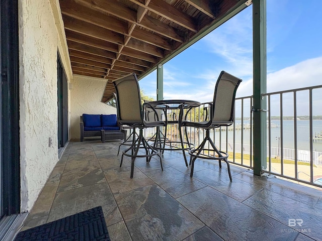 exterior space featuring a water view and a balcony