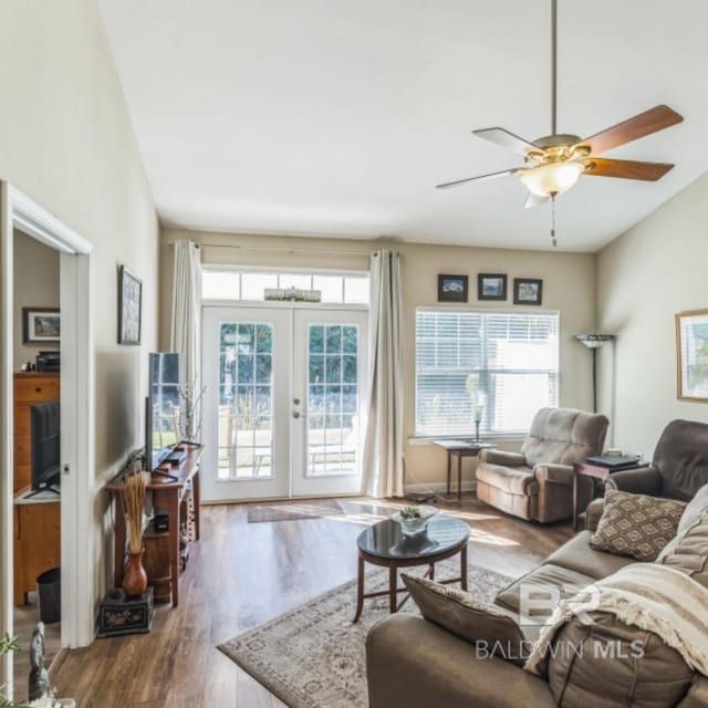 430 W Fort Morgan Rd Unit 1401, Gulf Shores, AL 36542 - living area with wood finished floors, a ceiling fan, and french doors