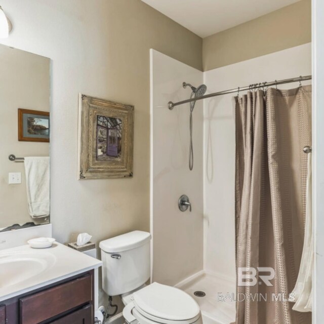 430 W Fort Morgan Rd Unit 1401, Gulf Shores, AL 36542 - full bath with vanity, curtained shower, and toilet