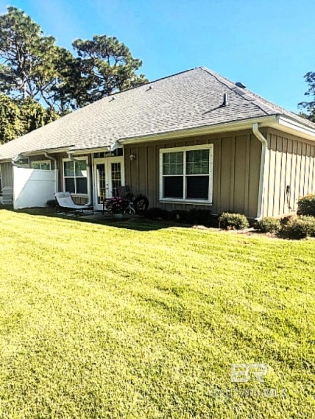 430 W Fort Morgan Rd Unit 1401, Gulf Shores, AL 36542 - back of house featuring board and batten siding and a shingled roof