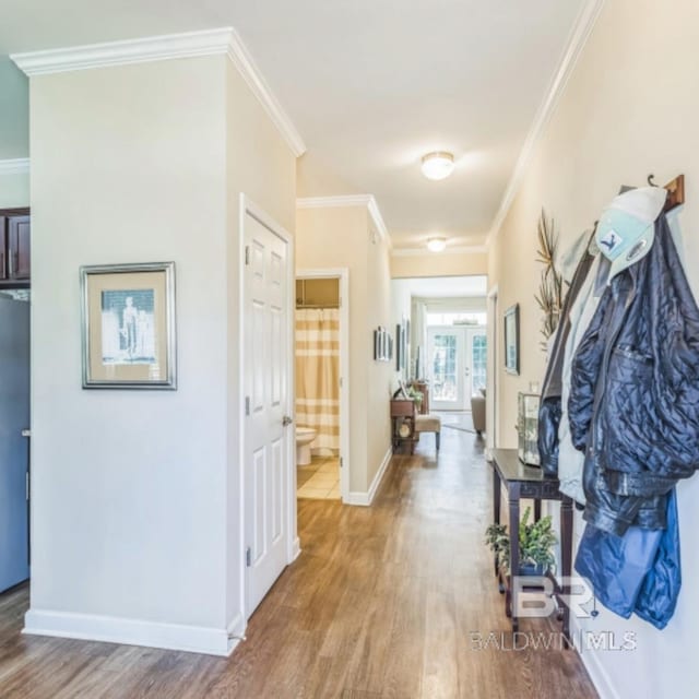430 W Fort Morgan Rd Unit 1401, Gulf Shores, AL 36542 - hallway featuring wood finished floors, ornamental molding, baseboards, and french doors