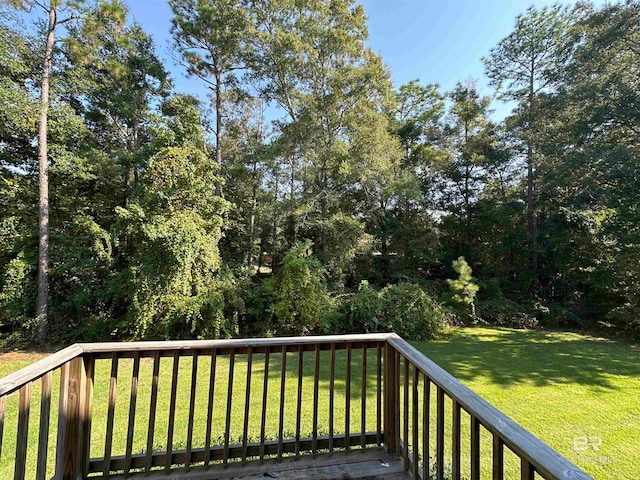 wooden deck with a yard