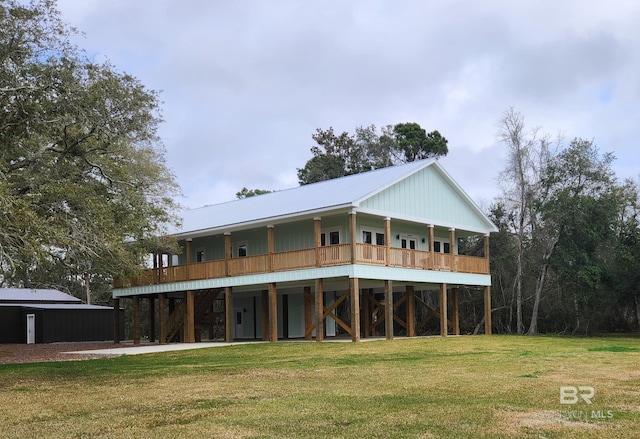 back of property with a lawn