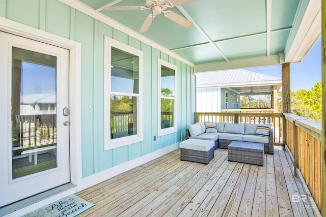 wooden terrace featuring ceiling fan and outdoor lounge area