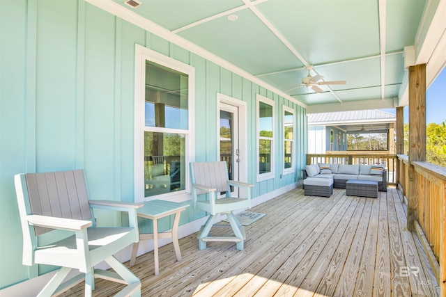 wooden deck featuring ceiling fan and outdoor lounge area