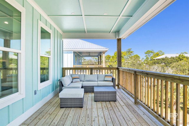 wooden terrace featuring outdoor lounge area