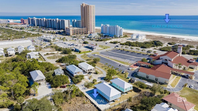 birds eye view of property with a view of city and a water view