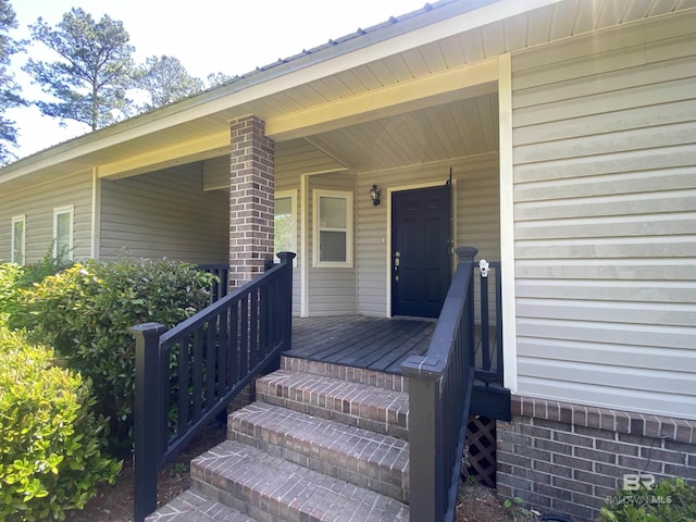 property entrance featuring covered porch