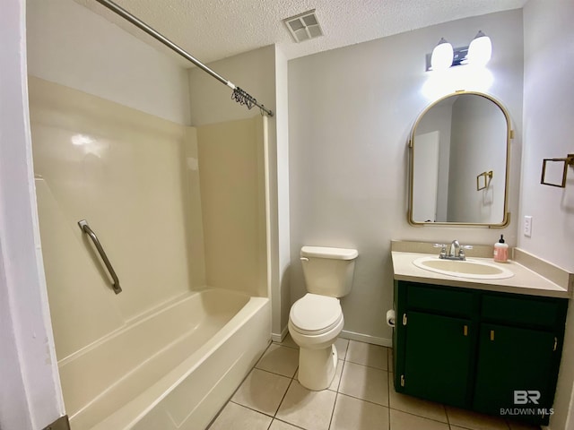 bathroom with toilet, vanity, a textured ceiling, visible vents, and tile patterned flooring
