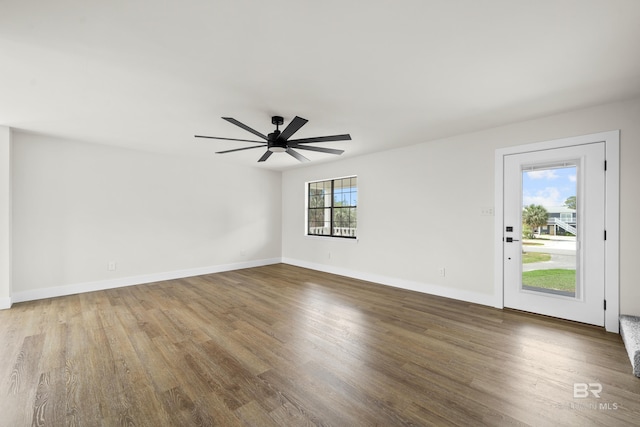 26498 Carondelette Dr, Orange Beach, AL 36561 - spare room with wood finished floors, a ceiling fan, and baseboards