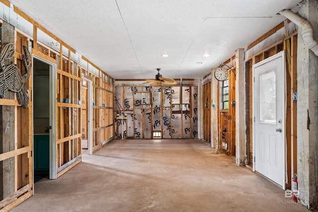 26498 Carondelette Dr, Orange Beach, AL 36561 - miscellaneous room featuring concrete floors and a ceiling fan