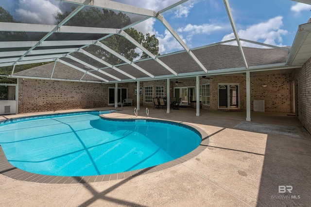 pool featuring ceiling fan, a patio area, french doors, and glass enclosure