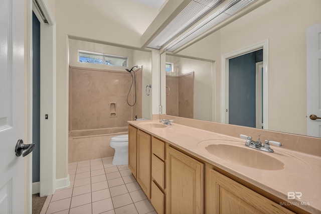 full bathroom featuring a sink, tile patterned floors, toilet, and double vanity