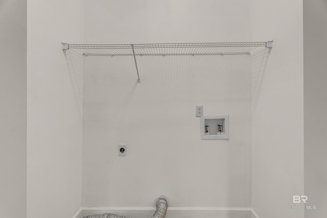 laundry room featuring washer hookup, hookup for an electric dryer, baseboards, and laundry area