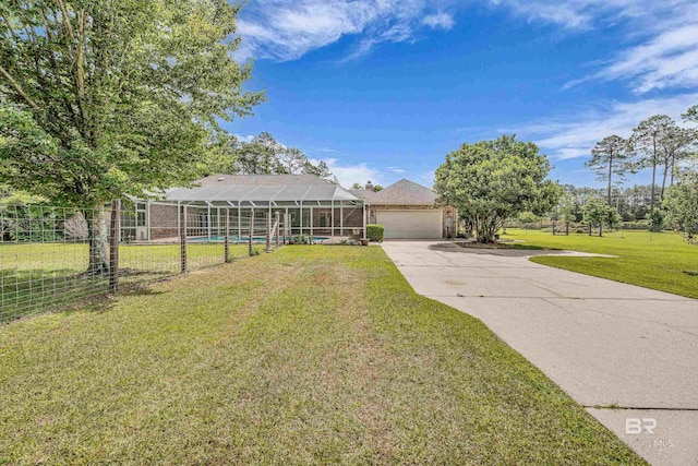 single story home with fence, driveway, a front lawn, and a garage