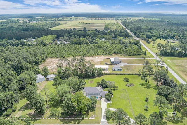 bird's eye view featuring a wooded view