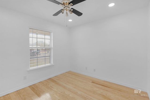 empty room featuring ceiling fan and light hardwood / wood-style flooring