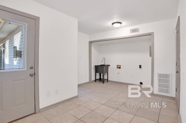 laundry room with light tile patterned floors, hookup for a washing machine, visible vents, and electric dryer hookup