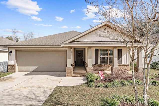 view of front of home featuring a porch and a garage