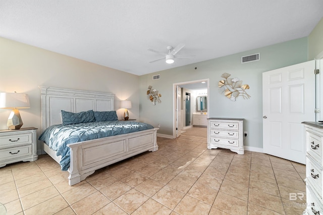 bedroom featuring light tile patterned flooring, visible vents, and baseboards