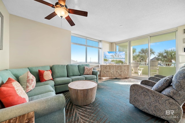 sunroom / solarium featuring a ceiling fan