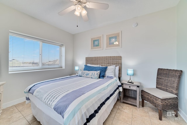 bedroom with light tile patterned flooring, baseboards, and ceiling fan