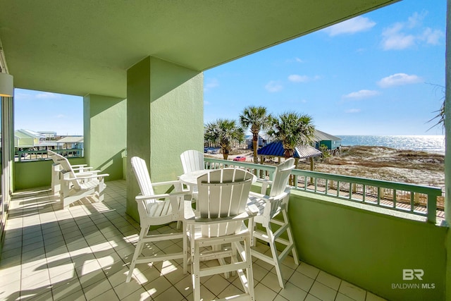 balcony featuring a water view