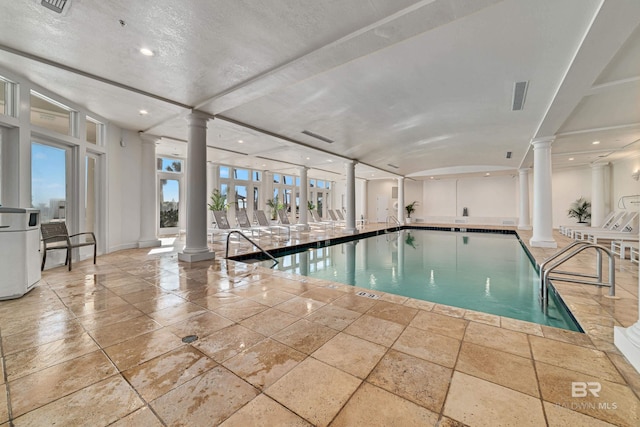 community pool with ornate columns