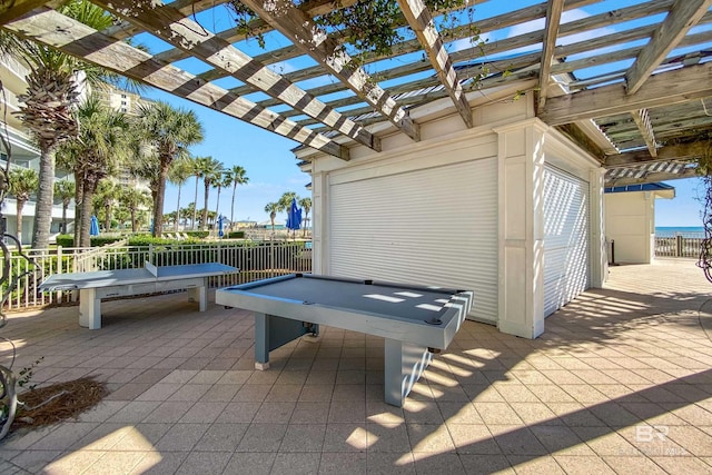 view of patio with fence and a pergola