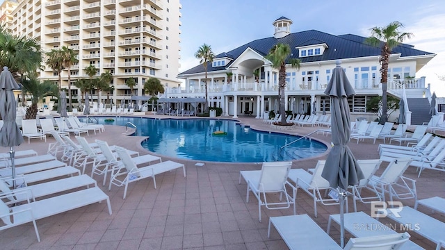 pool with a patio area