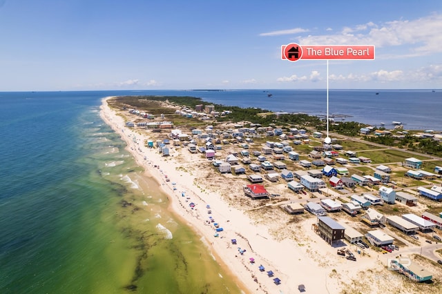 birds eye view of property with a view of the beach and a water view